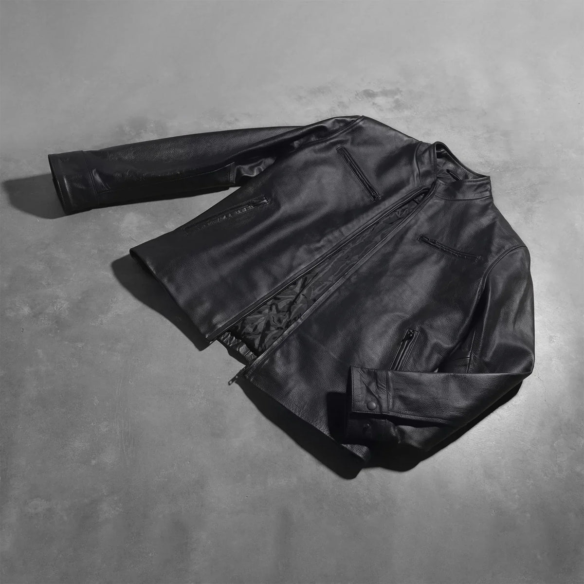 
Button & Hem Craftsmanship Construction Detail on Austere Matte Black Leather Biker Jacket