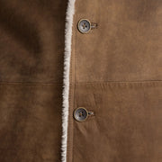 
Close-Up Detail of Notch & Button Hardware on Kolby Distressed Brown Shearling Long Coat