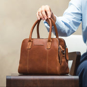 Styled Fit Perspective of Ezra Full-Grain Leather Handbag on Model - Natural Daylight Drape