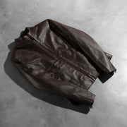 
Zipper & Hem Craftsmanship Construction Detail on Women's Rumella Maroon Leather Biker Jacket