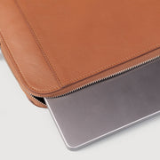 
Close-Up Detail of Classic Collar & Heavy-Duty Zipper Hardware on The Baxter Brown Leather Laptop Sleeve For Men & Women